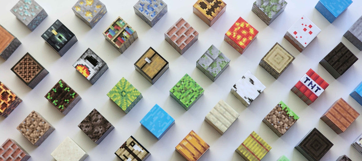 Assorted magnetic Minecraft-style building blocks on a white background