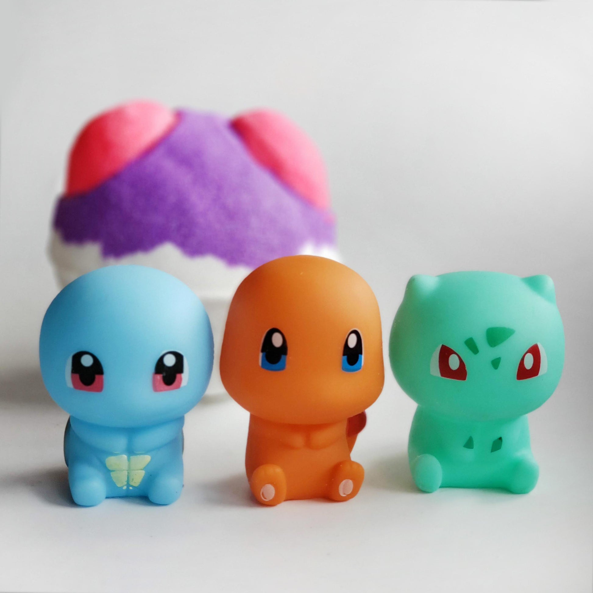charmander, bulbasaur, squirtle in front of master ball pokemon bath bomb