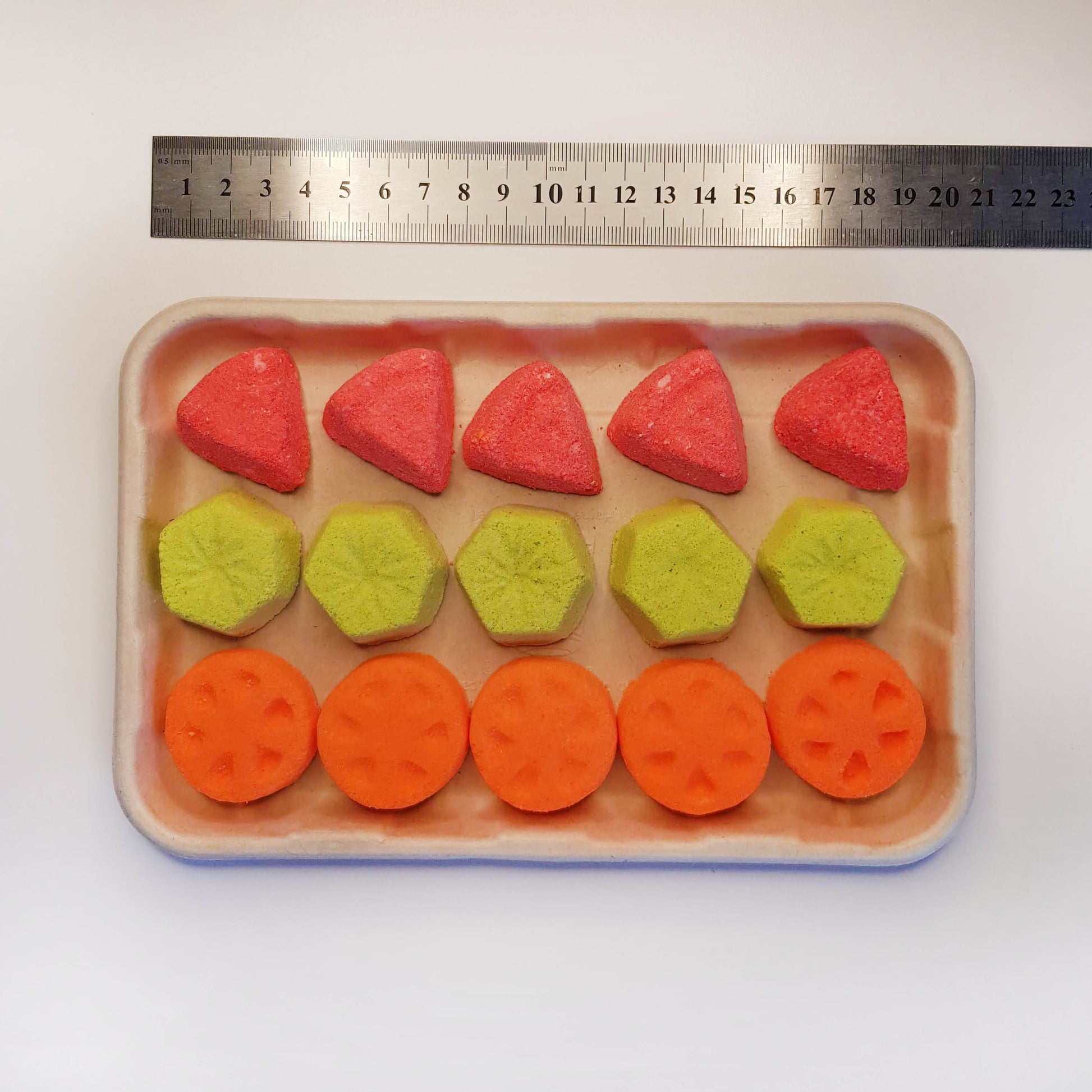Orange kiwi watermelon mini bath bombs in tray