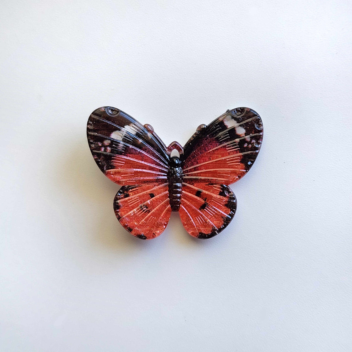 Burnt orange acrylic butterfly charm