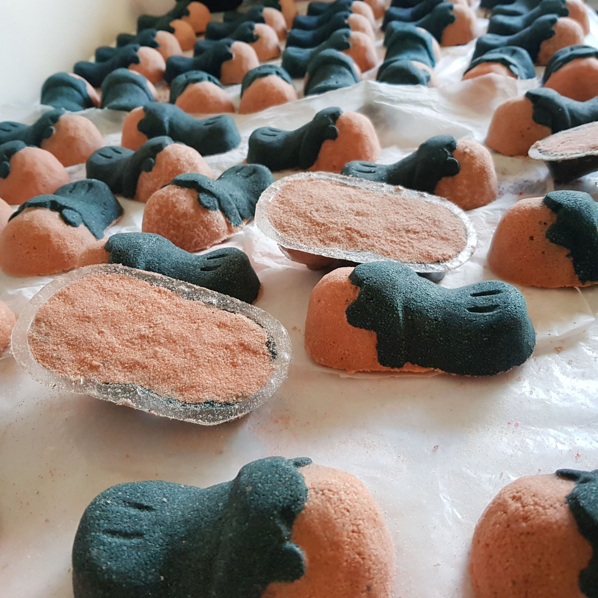 Close-up of Tea Tree platypus bath bombs showing their flat undersides