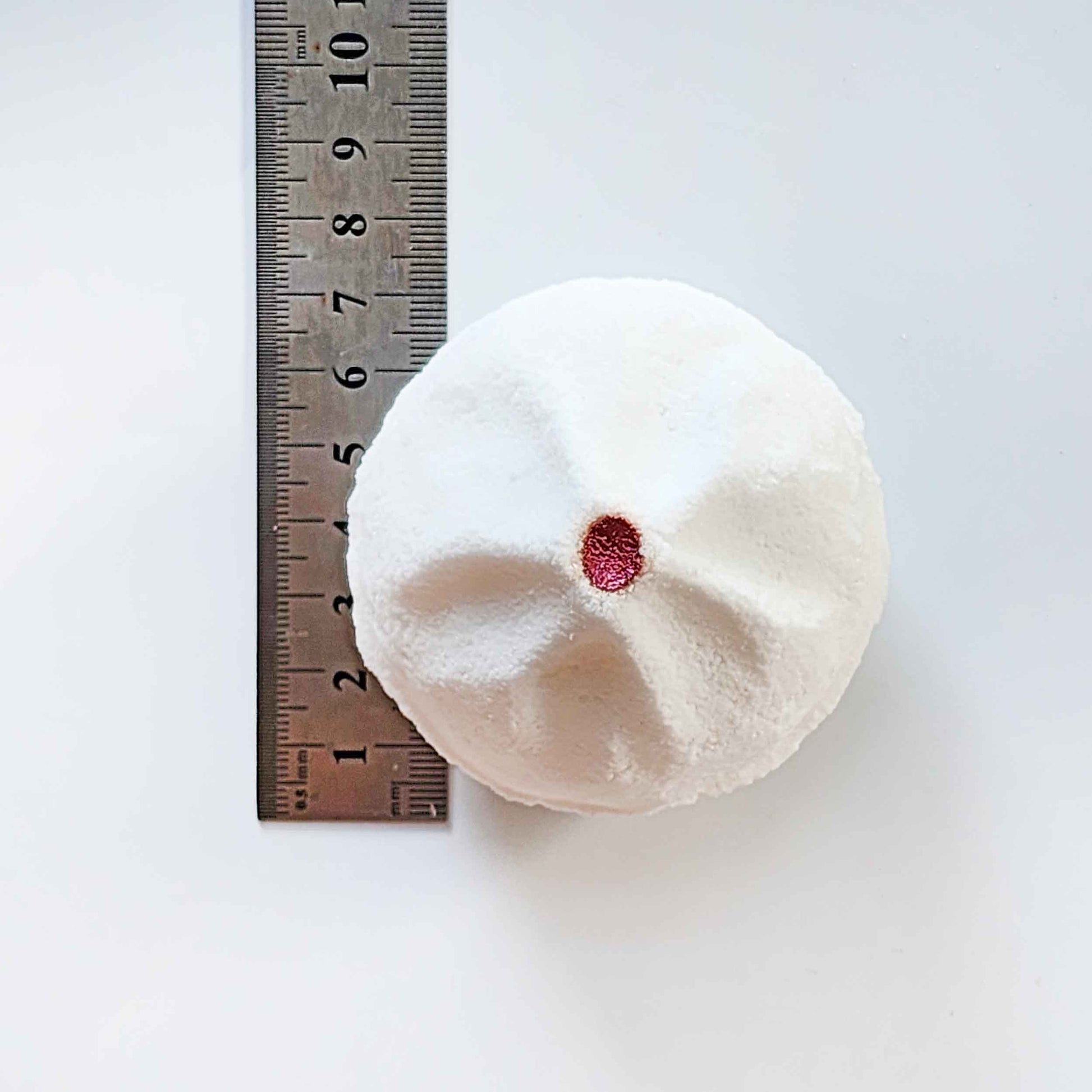 Top measurement of a Yum Cha bao bath bomb beside a ruler