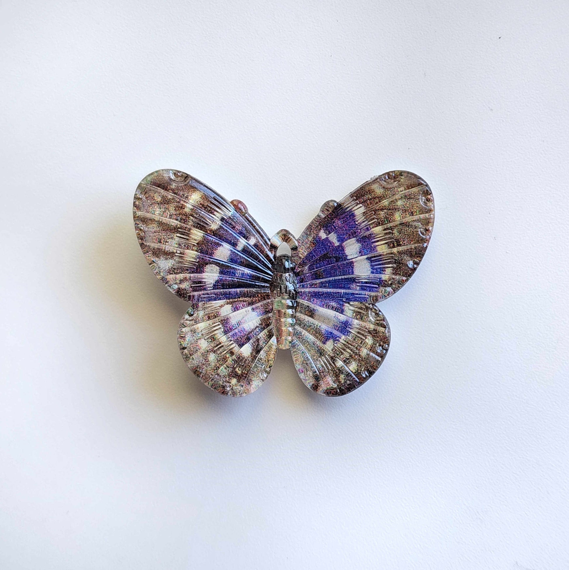 speckled brown and blue acrylic butterfly charm
