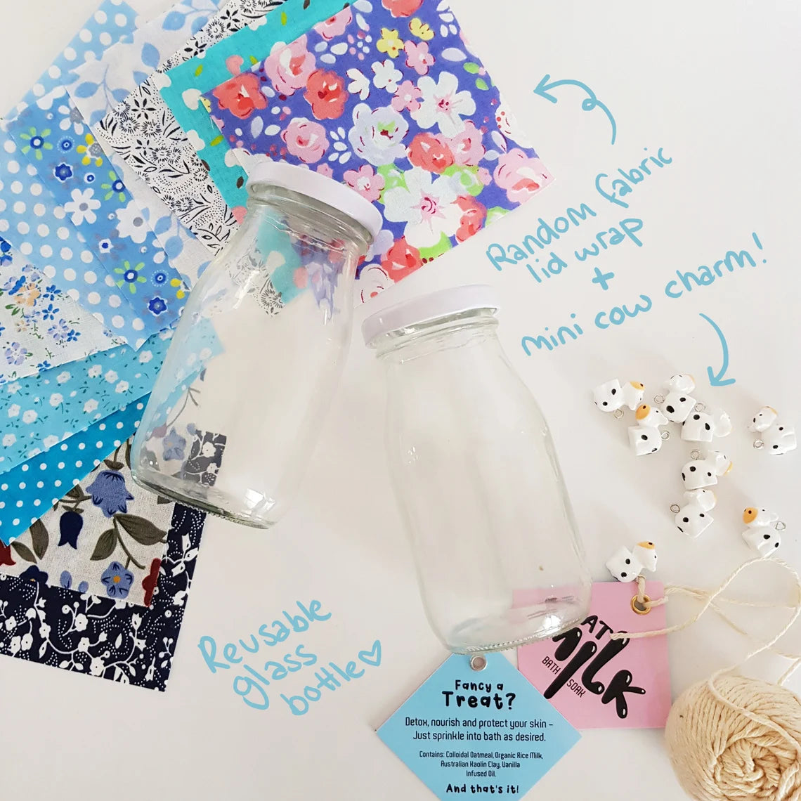 Reusable Milk Bath Soak bottles with fabric lid wraps, labels, twine, and cow charms