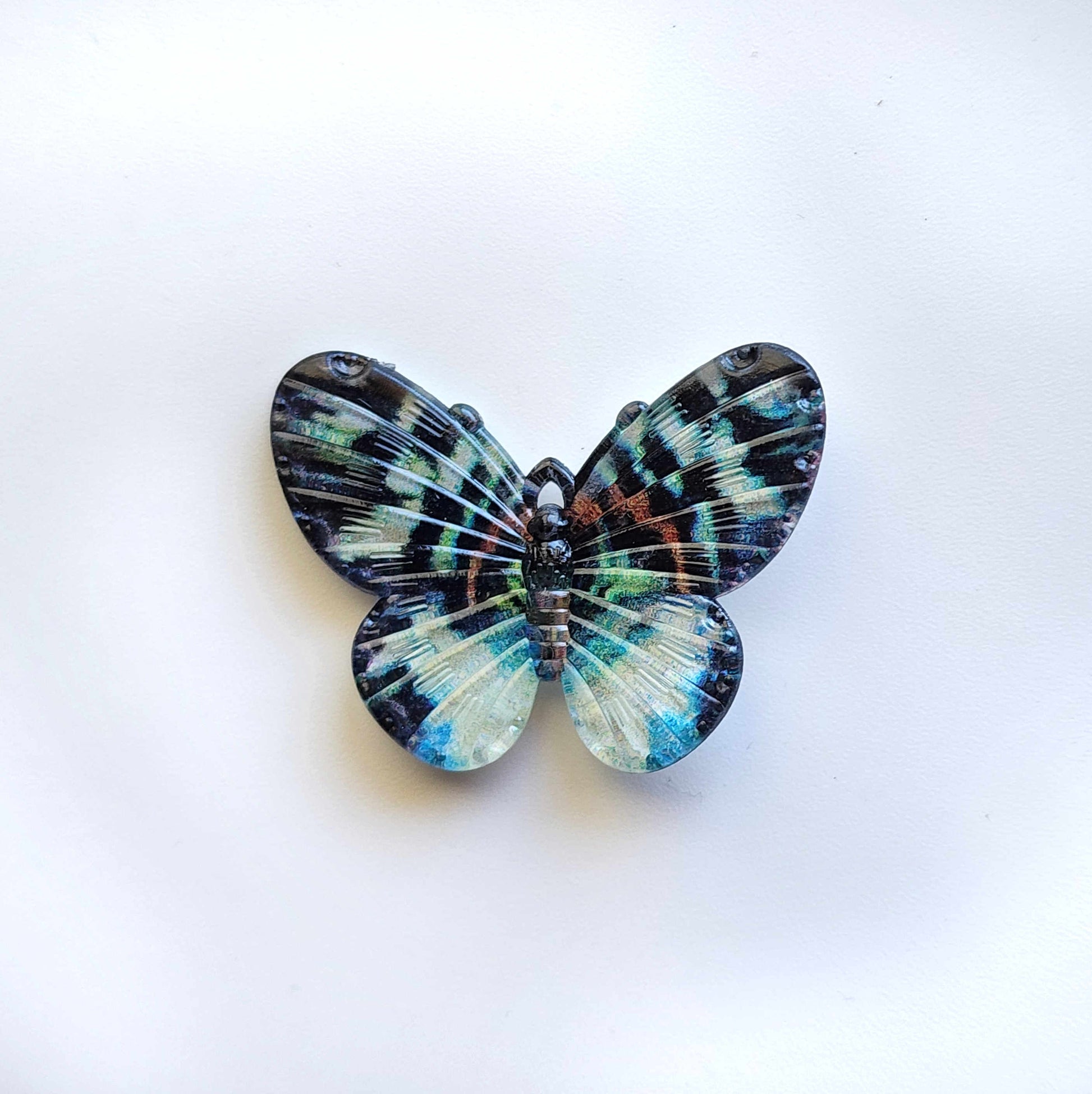 speckled blue and teal acrylic butterfly charm