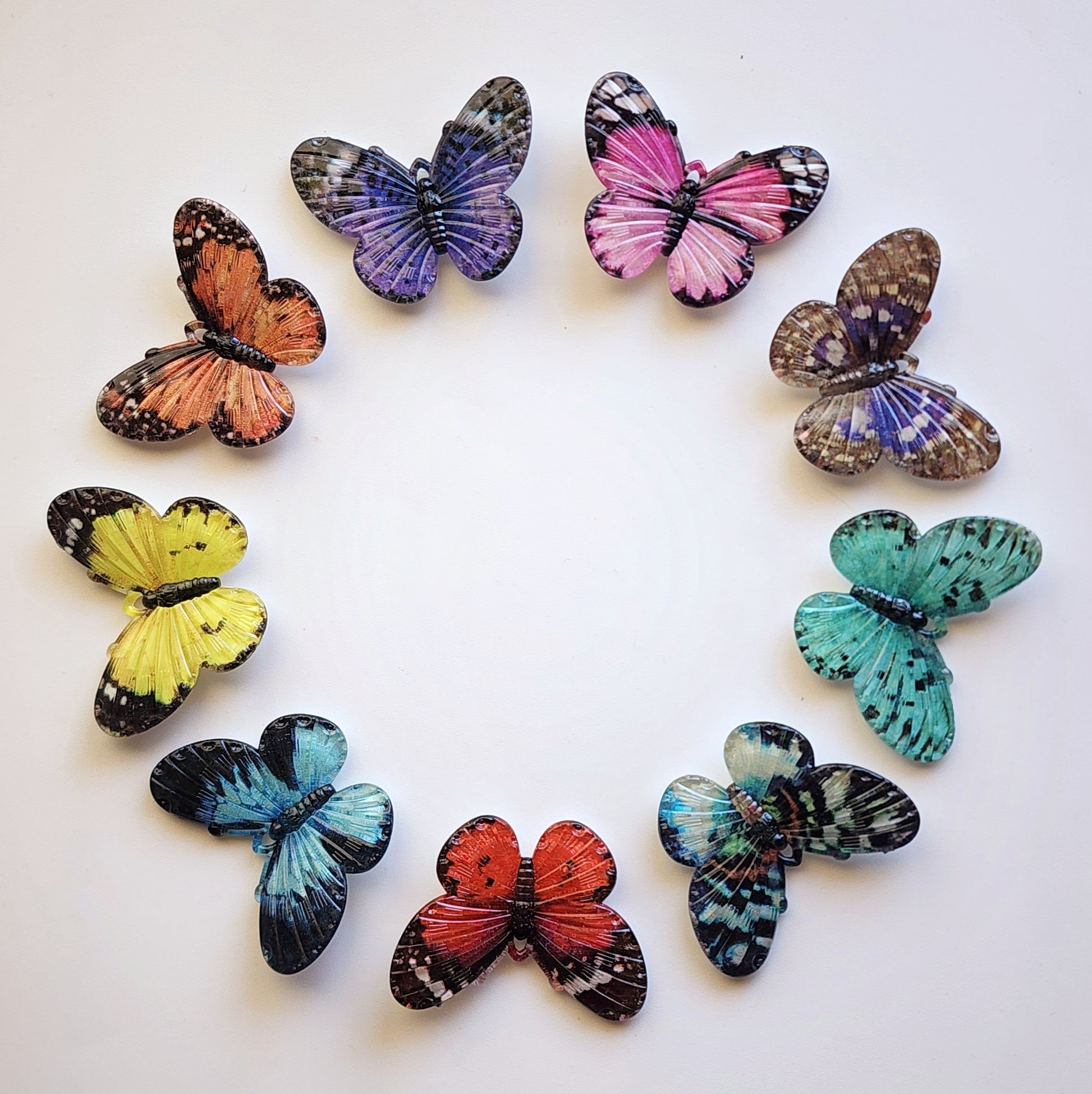 Ring of bright colourful acrylic butterfly charms