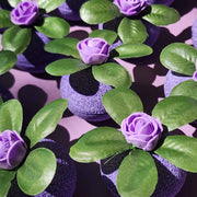 Purple Wild Berry bath bombs topped with green leaves and violet roses