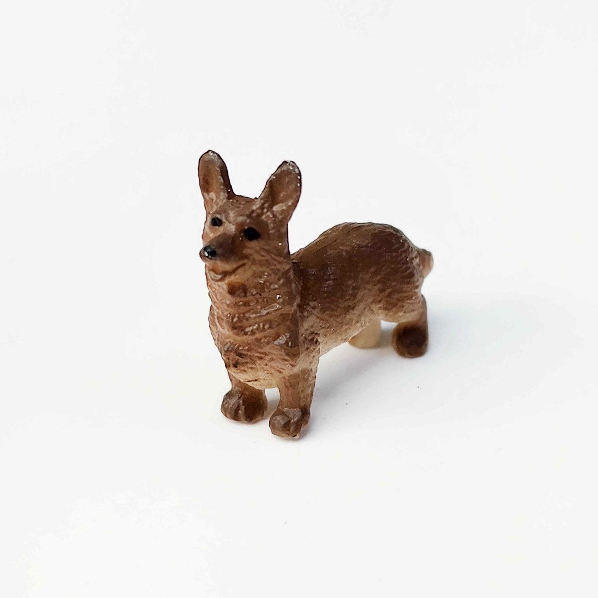Brown corgi PVC figurine standing on a plain white background