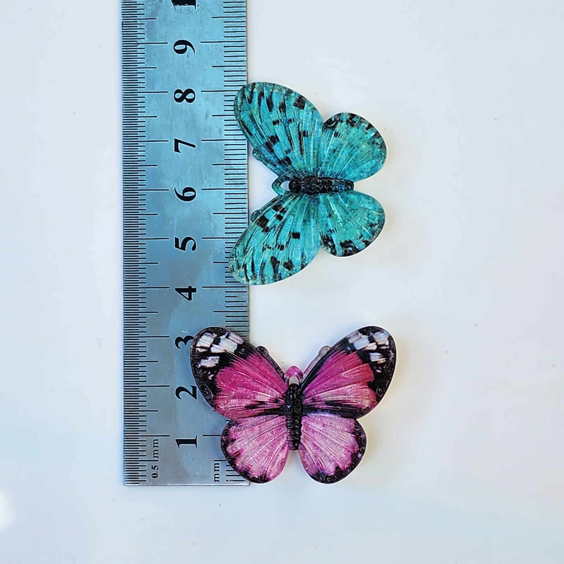 measurements of two acrylic butterfly charms
