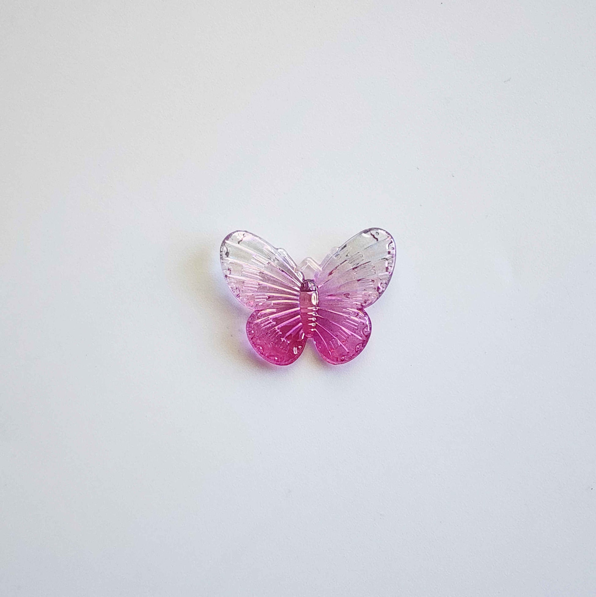 white and pink butterfly acrylic charm