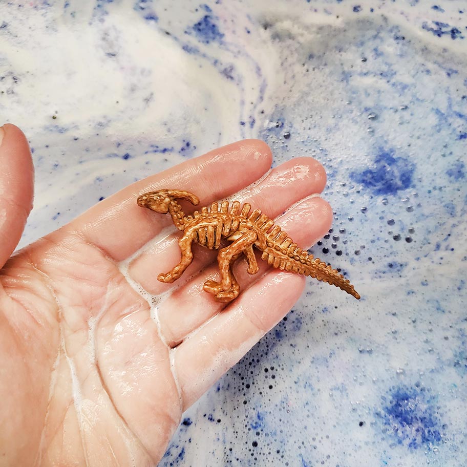 dinosaur toy from animal crossing fossil bath bomb