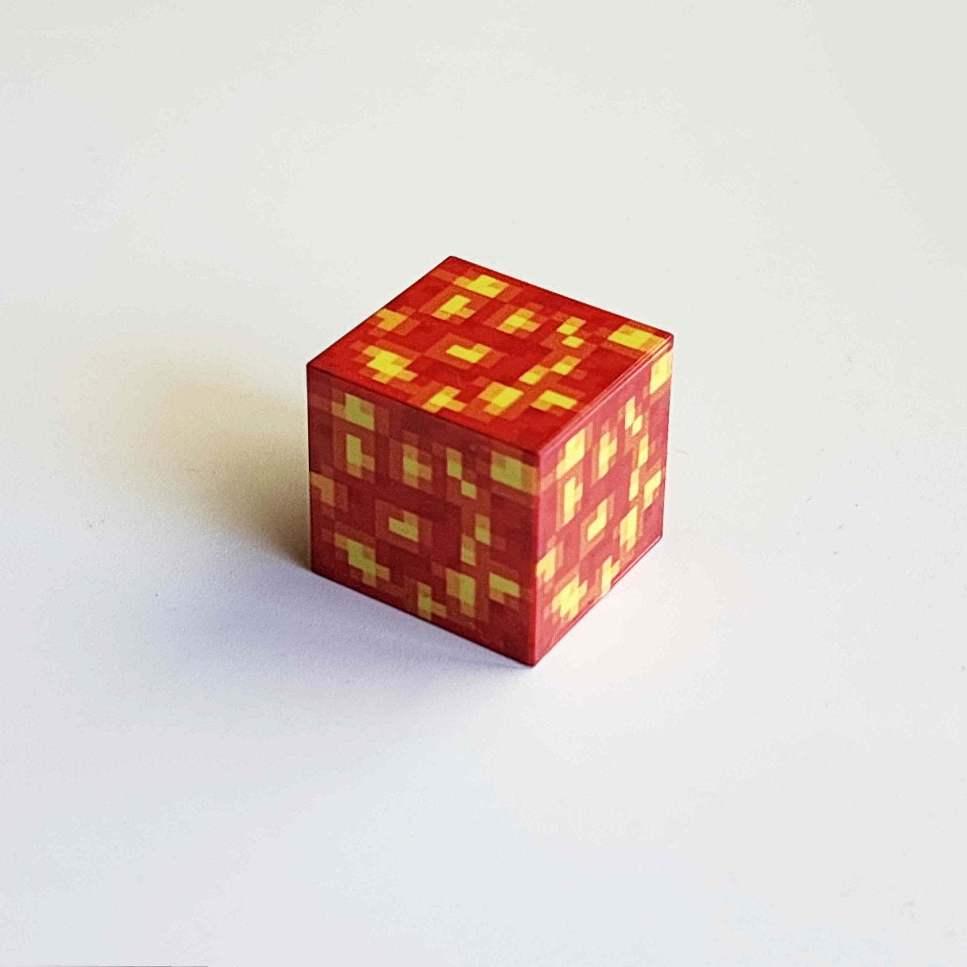 lava  textured magnetic minecraft building block on a white background