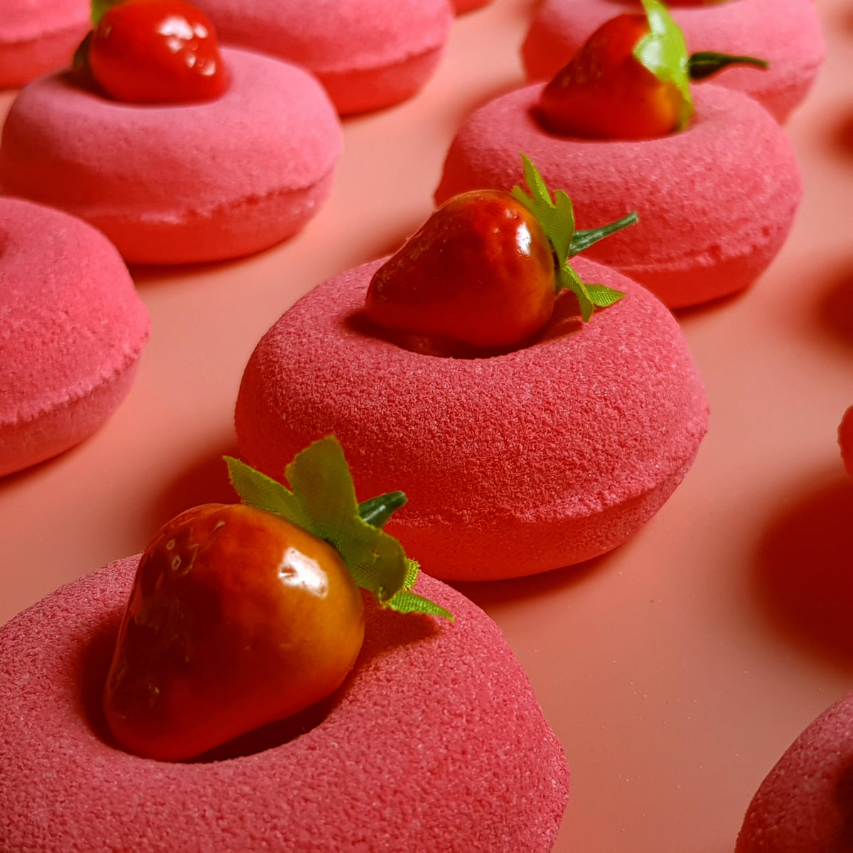 Red strawberry doughnut bath bomb