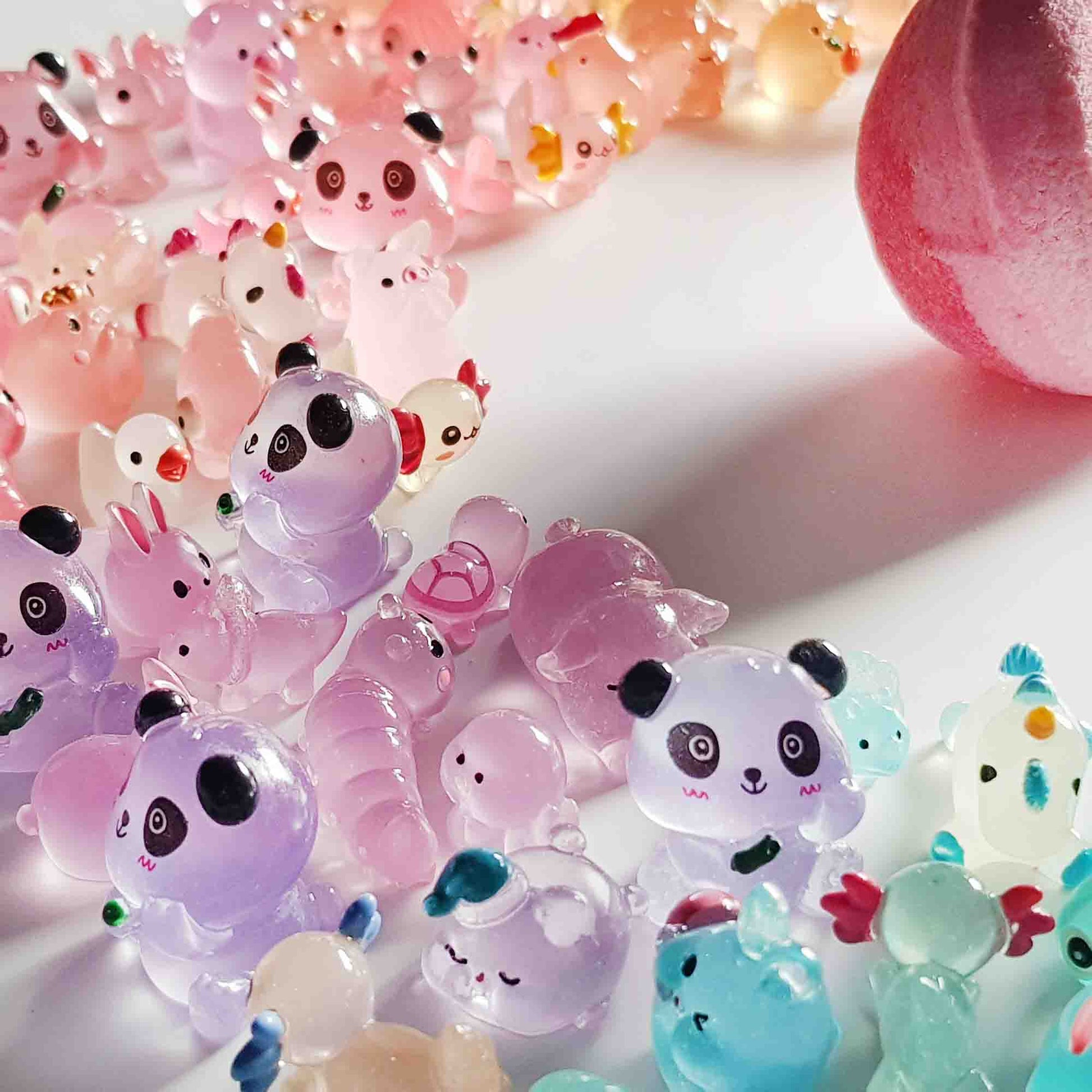 Close-up of translucent panda and animal fairy garden toys