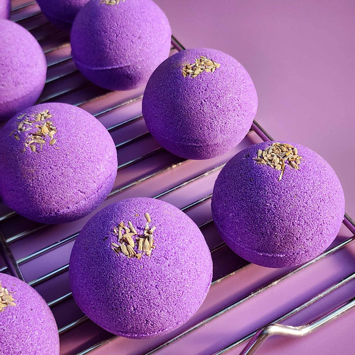 Close-up of Relax aromatherapy bath bombs on a metal rack