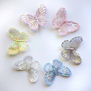 circle of clear iridescent acrylic butterfly charms in all sorts of colours