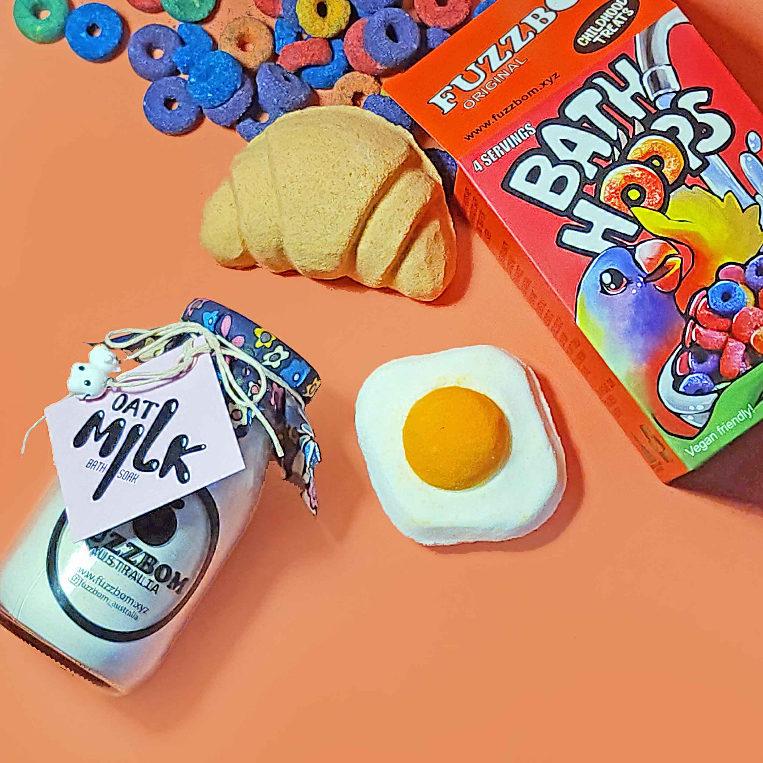 Breakfast in Bath bundle contents arranged on a peach background
