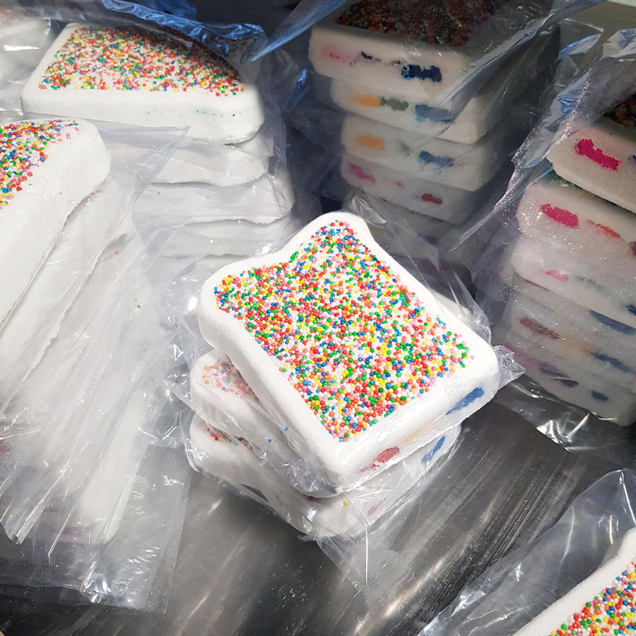 Wrapped fairy bread bath bombs ready for packing