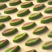 Long eucalyptus leaf shaped bath bombs on a plain beige background