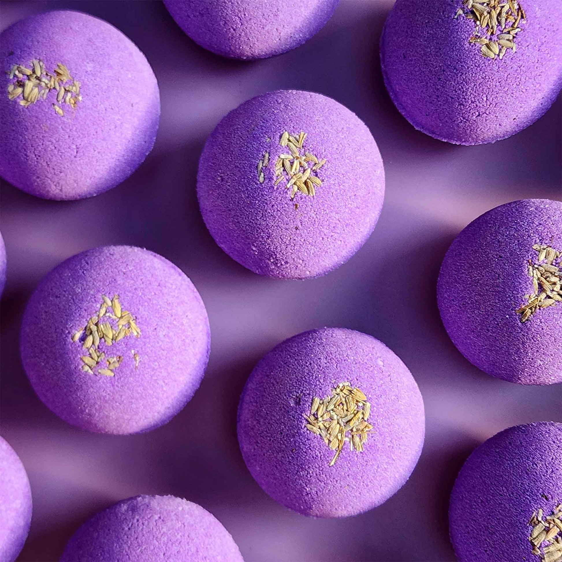 Purple Relax aromatherapy bath bombs topped with dried lavender