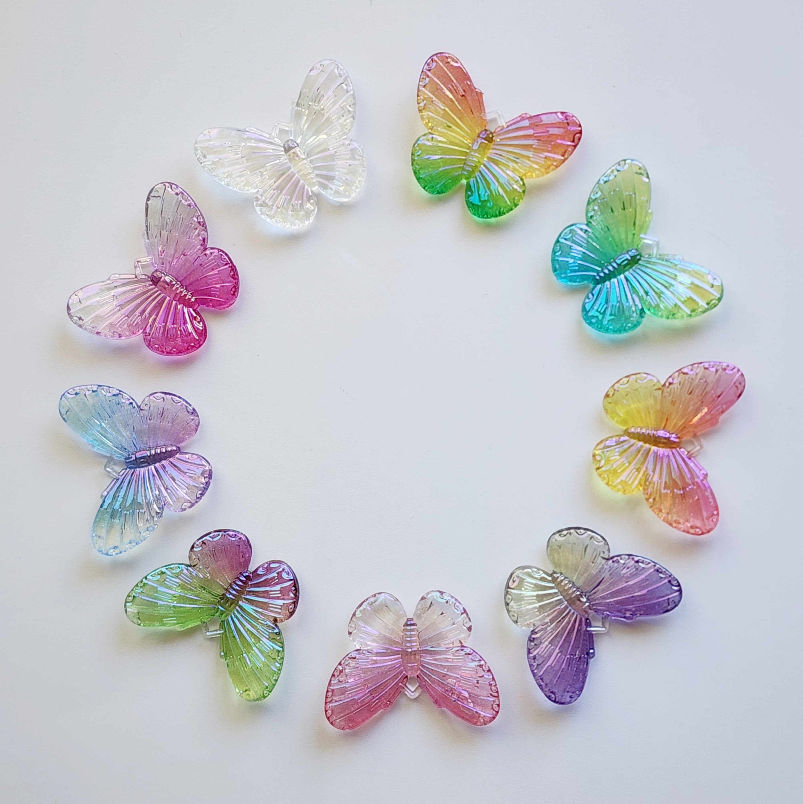 Circle of acrylic butterfly charms in an array of vibrant colours