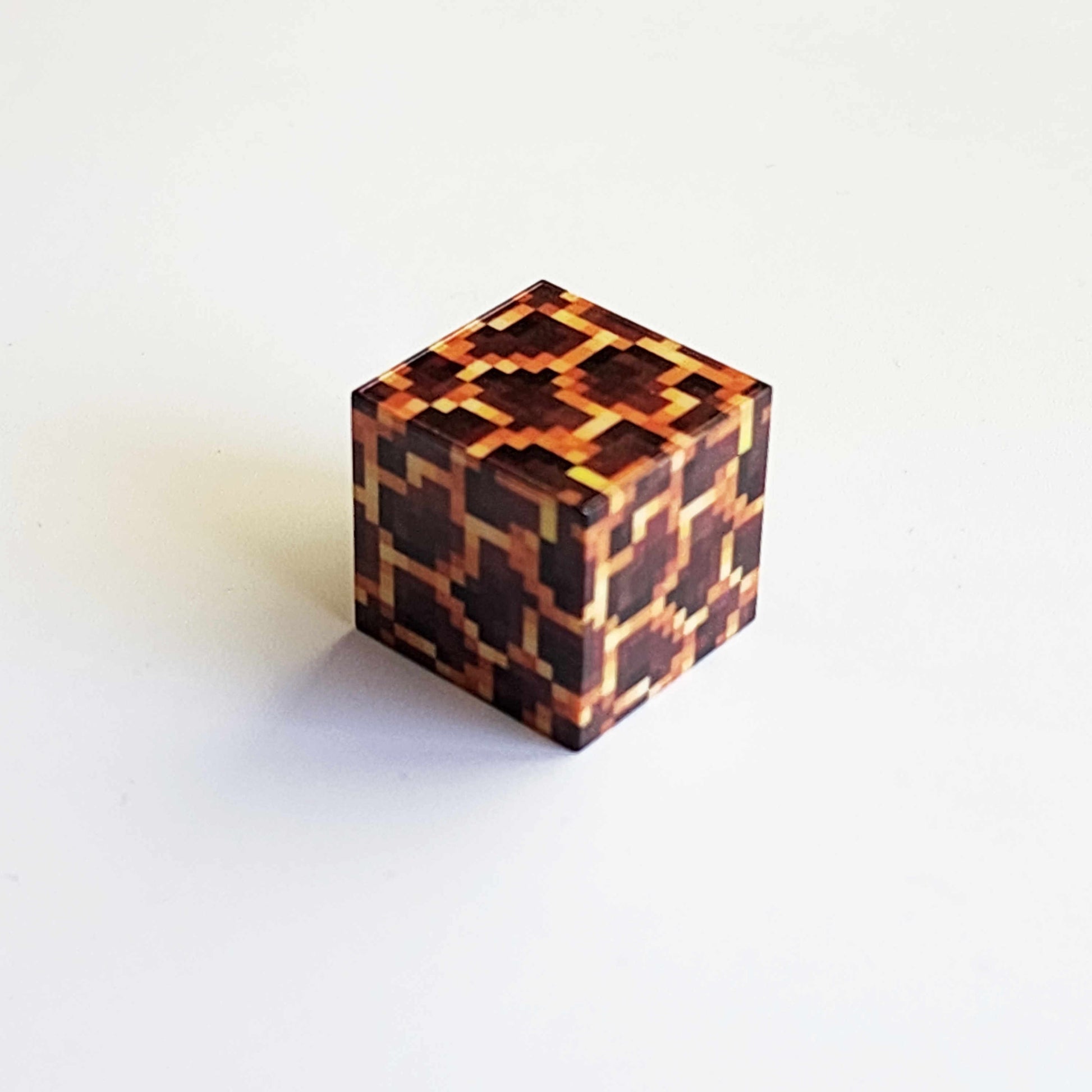 magma textured magnetic minecraft building block on a white background