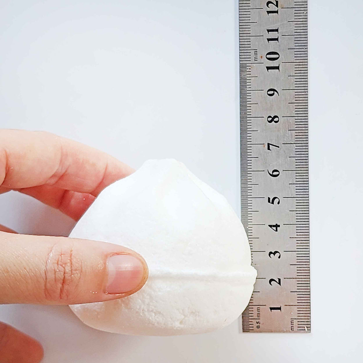 Side measurement of a Yum Cha bao bath bomb beside a ruler
