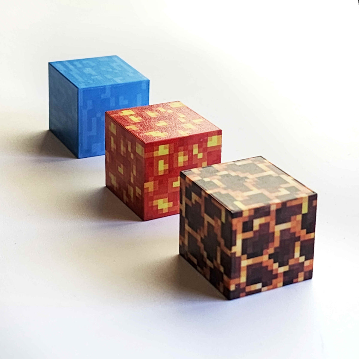 Row of magnetic minecraft blocks including lava, magma and water